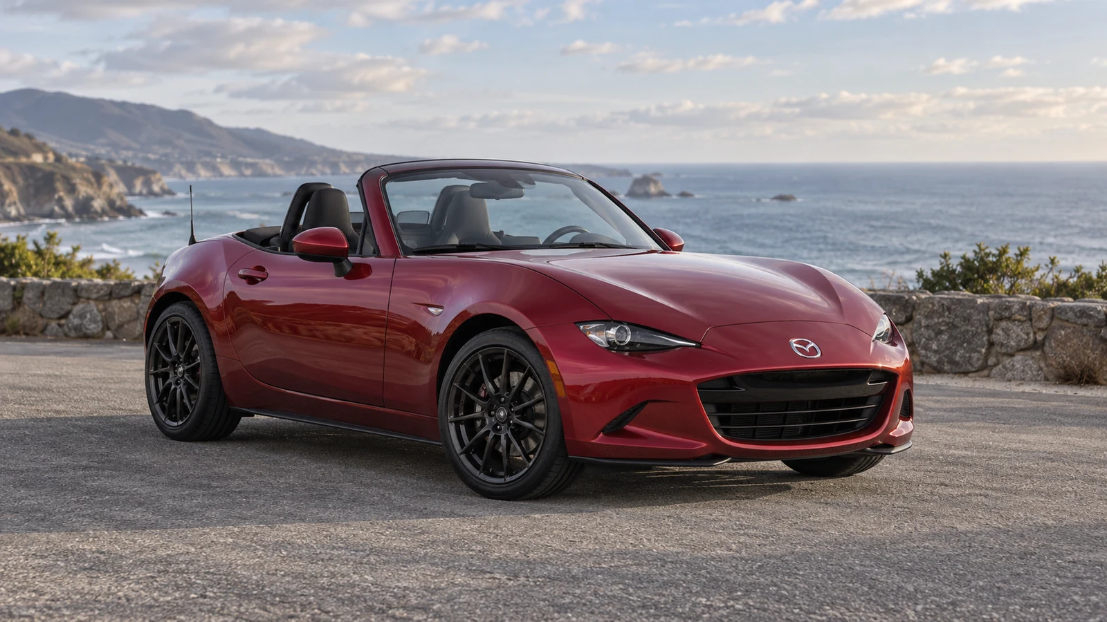 Red roadster with black multi-spoke wheels